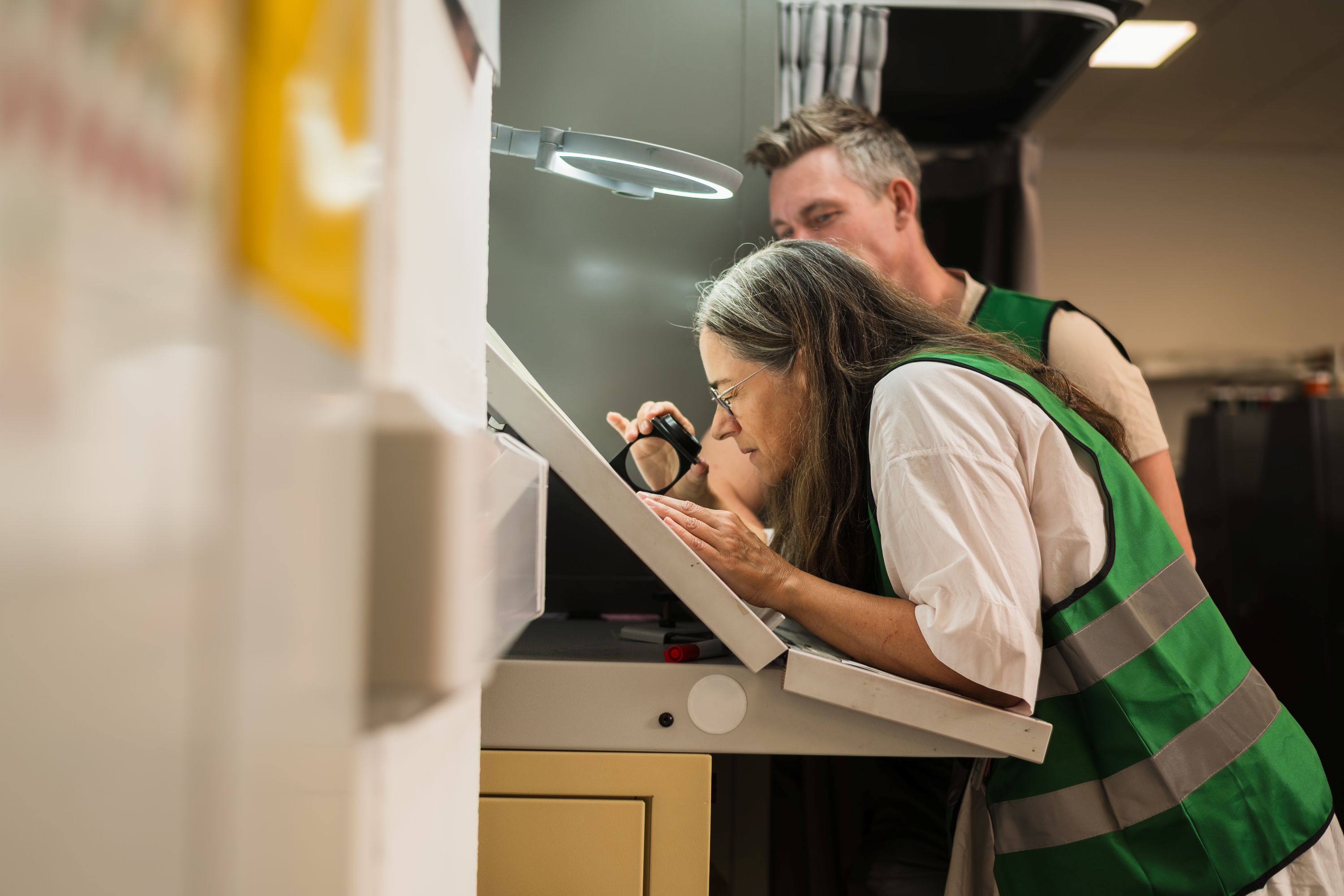 Jeanette looking closely at something.
